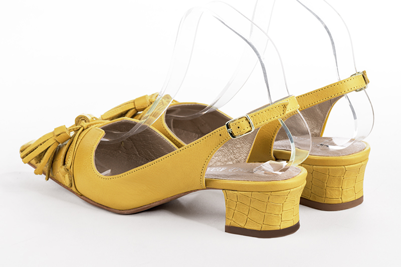 Yellow women's open back shoes, with a knot. Tapered toe. Low kitten heels. Rear view - Florence KOOIJMAN